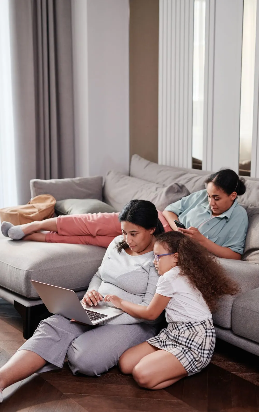 Family using fast home internet on laptop and phone